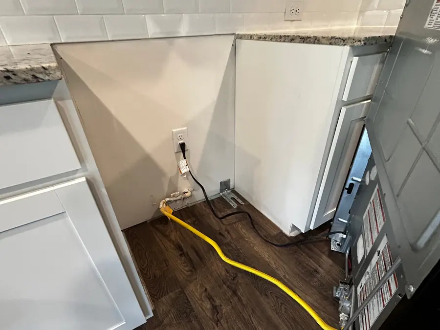 Kitchen in a building under construction, mid-installation, before the final cleanup
